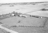 Aerial photograph of a farm near Prince Albert, SK (47-27-W2)
