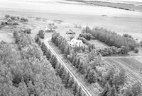 Aerial photograph of a farm near Four Corners, SK (60-18-W3)