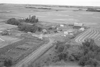 Aerial photograph of a farm near Marcelin, SK (46-6-W3)