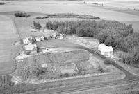 Aerial photograph of a farm near Meadowlake, SK (60-18-W3)