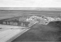 Aerial photograph of a farm near Borden, SK (41-8-W3)