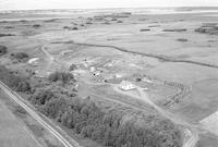 Aerial photograph of a farm near Cutknife, SK (44-22-W3)