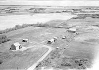 Aerial photograph of a farm near Cutknife, SK (30-44-22-W3)