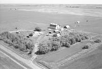 Aerial photograph of a farm near Cutknife, SK (44-21-W3)