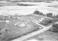 Aerial photograph of a farm near Hafford, SK (44-10-W3)