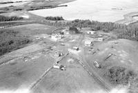 Aerial photograph of a farm near Marcelin, SK (45-7-W3)