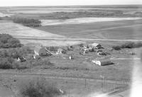 Aerial photograph of a farm near Northbattleford, SK (45-16-W3)