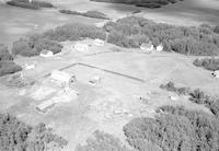 Aerial photograph of a farm near Turtleford, SK (51-20-W3)