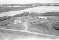 Aerial photograph of a farm near Turtleford, SK (51-20-W3)