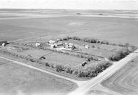 Aerial photograph of a farm near North Battleford, SK (45-16-W3)