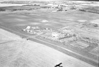Aerial photograph of a farm near Speers, SK (15-43-11-W3)