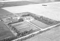 Aerial photograph of a farm near Marcelin, SK (46-6-W3)