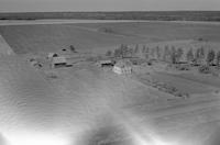 Aerial photograph of a farm near Lily Plains, SK (48-28-W2)