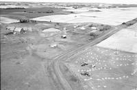 Aerial photograph of a farm near Lily Plains, SK (48-28-W2)
