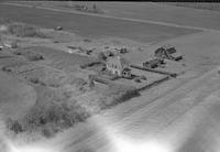 Aerial photograph of a farm near Great Dear, SK (41-8-W3)