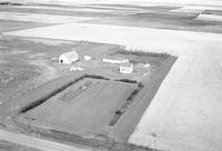 Aerial photograph of a farm near Blaine Lake, SK (42-7-W3)