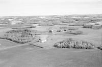 Aerial photograph of a farm near Cutknife, SK (44-21-W3)