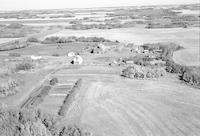 Aerial photograph of a farm near Marcelin, SK (45-7-W3)