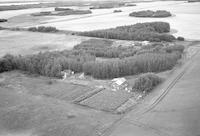 Aerial photograph of a farm near Meadow Lake, SK (60-17-W3)