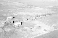 Aerial photograph of a farm near Richard, SK (44-12-W3)