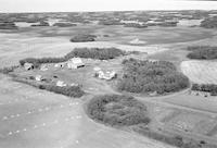 Aerial photograph of a farm near Marcelin, SK (45-7-W3)