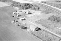 Aerial photograph of a farm near Cutknife, SK (43-21-W3)