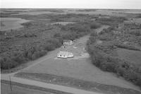 Aerial photograph of a farm near Scott, SK (38-21-W3)