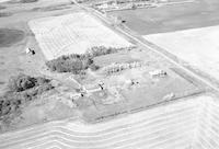 Aerial photograph of a farm near Cutknife, SK (44-21-W3)