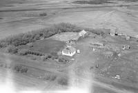 Aerial photograph of a farm near Revenue, SK (38-21-W3)