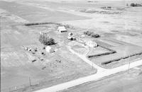 Aerial photograph of a farm near Meadow Lake, SK (60-18-W3)