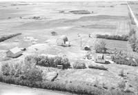 Aerial photograph of a farm near Cutknife, SK (43-22-W3)