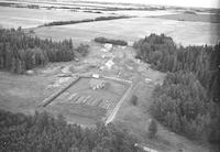 Aerial photograph of a farm near Lily Plains, SK (48-28-W2)