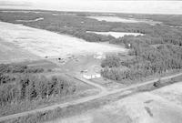 Aerial photograph of a farm near Mervin, SK (51-20-W3)