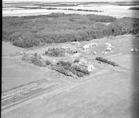 Aerial photograph of a farm near Kerrobert, SK (34-21-W3)