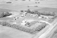 Aerial photograph of a farm near Meadow Lake, SK (60-18-W3)