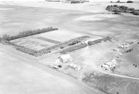 Aerial photograph of a farm near Meadow Lake, SK (59-17-W3)