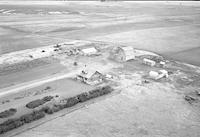 Aerial photograph of a farm near Hafford, SK (44-10-W3)