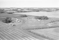 Aerial photograph of a farm near Blaine Lake, SK (45-7-W3)