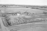 Aerial photograph of a farm near Meadow Lake, SK (60-18-W3)