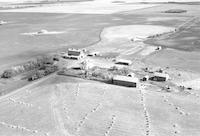 Aerial photograph of a farm near Blaine Lake, SK (45-7-W3)