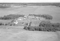 Aerial photograph of a farm near Heath, Alta