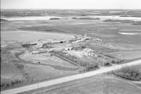 Aerial photograph of a farm near Cutknife, SK (22-43-W3)