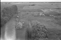 Aerial photograph of a farm near Fielding, SK (41-11-W3)