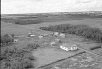 Aerial photograph of a farm near Lily Plains, SK (48-28-W2)