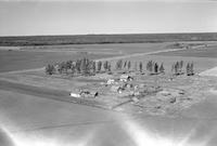 Aerial photograph of a farm near Great Deer, SK (41-8-W3)