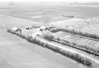 Aerial photograph of a farm near Borden, SK (39-10-W3)