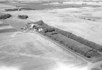 Aerial photograph of a farm near Meadow Lake, SK (60-17-W3)