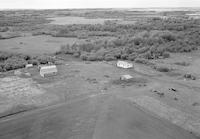 Aerial photograph of a farm near Four Corners, SK (60-18-W3)