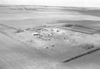 Aerial photograph of a farm near Cutknife, SK (44-22-W3)