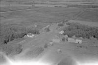 Aerial photograph of a farm near Hafford, SK (44-10-W3)